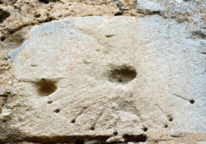 Remnants of the sundial from the lining of the entrance portal.