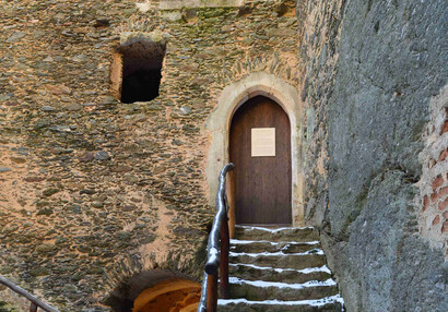 Gothic portal with characteristic carved arch.